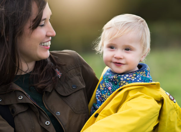 Mother looking lovingly at her baby during photoshoot in Benson